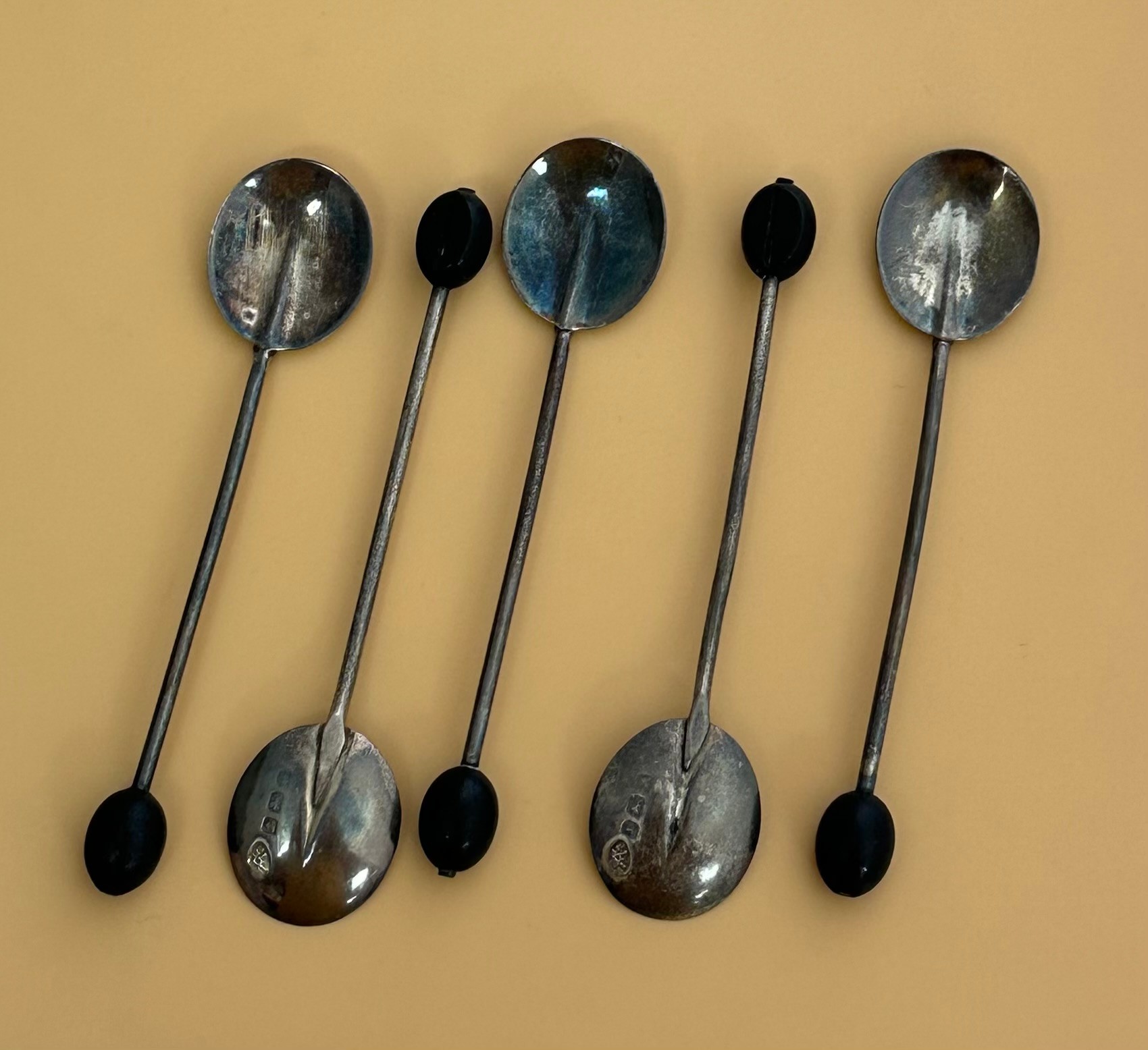 Five silver coffee spoons with coffee bean . Hallmarks for Adie Brothers, 1925, Birmingham. Weight