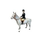 Beswick ‘Hunstwoman’ figure, black jacketed huntswoman on grey horse figure. Stamped Beswick to