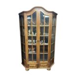 Glazed display cabinet with two doors and glazed side panels over two drawers, width 130cm, depth