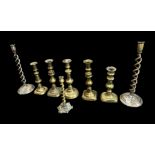Small selection of brass candle sticks, to include; pair of barley twist height 35cm (2), smaller