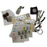 A selection of items. Contains some coins including a boxed 1951 Festival of Britain coin, stamps,