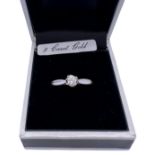 A white gold ring stamped 375 and set with 0.2ct diamond. Size N. Total weight 1.8g.