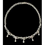 A silver marcasite and imitation pearl necklace, stamped 925. Weight 24.8g Please see the buyer's