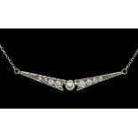 A vintage diamond wishbone necklace. Wishbone shaped plaque with central diamond (approx 0.4ct) with