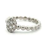 An 18ct white gold pavé diamond ball ring, stamoed 750. Diamond weight 0.38ct. Size M. Total