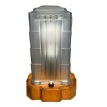 A Sabino frosted glass art deco lamp cover in the form of a four tier building with carved wooden