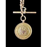 A 9ct gold hallmarked Albert watch chain with a 9ct gold hallmarked medallion inscribed '