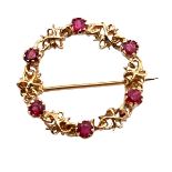 A 9ct gold and ruby circlet brooch, 22mm in diameter, weight 2.44 g. Please see the buyer's terms