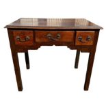 18th Century mahogany three-drawer lowboy, raised on squared legs with three fitted drawers having