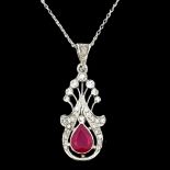 A ruby and diamond openwork white gold pendant