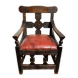 An interesting arts and crafts oak arm chair with a Celtic design, measures 58cm by 58cm by height