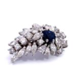 A diamond and sapphire brooch with bale attached so can also be worn as a pendant.