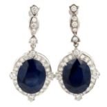 A pair of gold, sapphire and diamond earrings. The treated sapphires are 15mm x 12mm. Unmarked