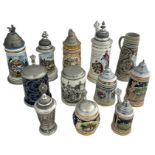 Collection of twelve German ceramic and pewter beer steins, of various designs and sizes to include;