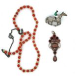 Some vintage jewellery items including a coral necklace stamped 'sterling', a closed-back garnet