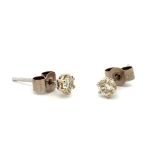 18ct white gold diamond stud earrings. Total diamond weight approx 0.2ct. Hallmark on posts, backs