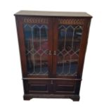 Mahogany display cabinet with astragal glazed doors over cupboard with drop-down door, width 84cm,