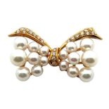 Mikimoto - an 18ct gold, cultured pearl and diamond bow brooch