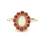 A white opal and ruby cluster set in hallmarked 9ct yellow gold.