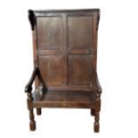 18th Century English oak settle, circa 1725 made from a wall panel, later seat lid. Width 94cm,