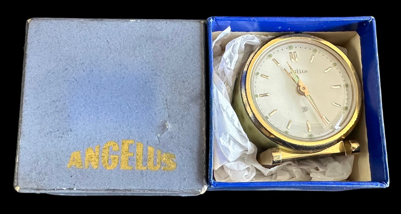 Angelus 8 Day brass Travel /Alarm clock, round form with marbled finish. Marked to base 1045. Wind