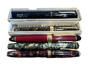 Four Conway Stewart Fountain Pens with 14 carat gold nibs two boxed. One German pen. 5 in total