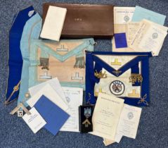 Freemasons Masonic items to include; a brown leather case marked G.Mc.A., a pair of aprons, a pair