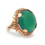 A large green chalcedony dress ring with Polish hallmark for approx 14ct gold, (583). Size N/O.