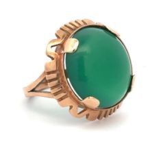 A large green chalcedony dress ring with Polish hallmark for approx 14ct gold, (583). Size N/O.