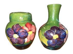Moorcroft – A Moorcroft Clematis pattern pair of items to include a small vase, impressed