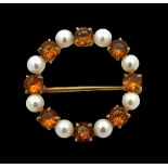 A citrine and cultured pearl 9ct gold circlet brooch. 27mm in diameter. Weight 4.8g. Please see