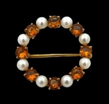 A citrine and cultured pearl 9ct gold circlet brooch. 27mm in diameter. Weight 4.8g. Please see