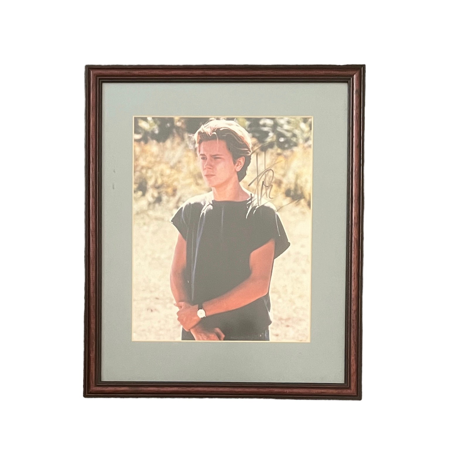 River Phoenix (1970-1993) – A framed colour photograph signed by River Phoenix in black ink “River - Image 2 of 2