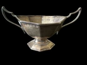 A small silver octagonal twin-handled bowl, marked E.S. Barnsley & Co, Birmingham 1911. Weight 43g.