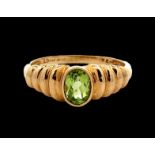 An oval peridot 9ct gold ring, size Q. Weight 2.58g. Please see the buyer's terms and conditions for