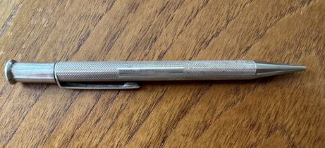 A silver pencil with Birmingham 1964 hallmarks. Length 117mm approx, weight 16g. Name plate is not