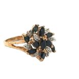 A sapphire and diamond flower cluster ring, set in 9ct gold. Size P. Weight 3.41g. Please see the