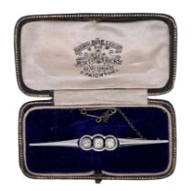 A diamond bar brooch in unmarked gold (tests inc pin as approx 14ct) faced with platinum. White