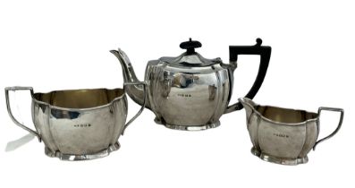 A three piece silver tea service by Hobson, James & Gilby, comprising of a teapot (with loose