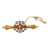 An Edwardian 15ct gold, topaz and seed pearl flower bar brooch. Chester 1905 hallmarks. Length 45mm.