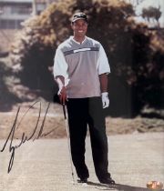 A signed photo of Golf legend Tiger Woods, in a frame. With COA from Sportizus. PSA3539. Image
