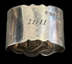 Silver Coronation Celebration napkin ring with the insignia for the arms of the Worshipful Co. of