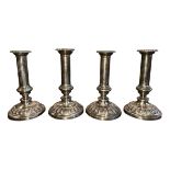 Four Sheffield Plate silver plated candle sticks. Height 19.5cm. (4)