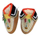 A small pair of Native American bead and hide Moccasins, early 20th Century, Floral beadwork
