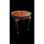 Walnut Pie Crust Occasional table, stood on four legs with claw & ball feet. Height 72cm, diameter