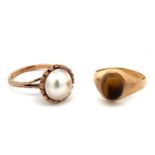 Two 9ct gold rings. One set with a tiger's eye cabochon, size P - shank misshapen with some nicks