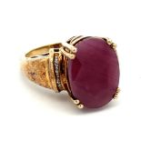 A large ruby and silver gilt ring with white stone shoulders. stamped 925. Size O. Ruby is treated