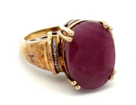 A large ruby and silver gilt ring with white stone shoulders. stamped 925. Size O. Ruby is treated