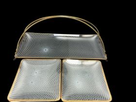 A set of six glass Art Deco style sandwich plates on a metal stand