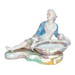 Meissen, a late 19th Century Meissen figural sweetmeat / bonbon porcelain dish, modelled as a